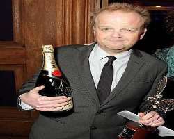 Toby Jones consuming alcohol